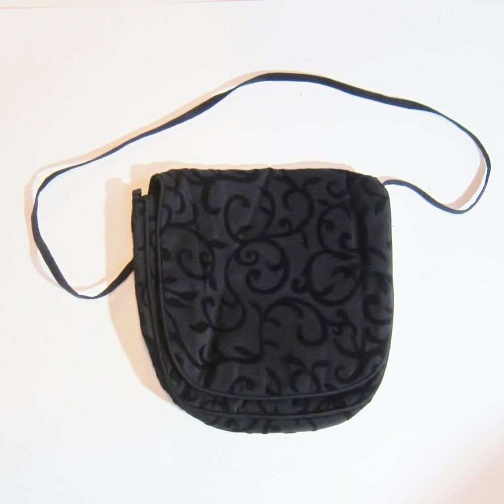 Beautiful, supremely elegant foldover shoulder bag with designs